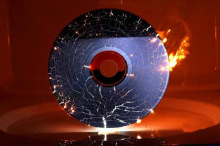 Illustration for article titled Gorgeous Shots Of Microwaved CDs